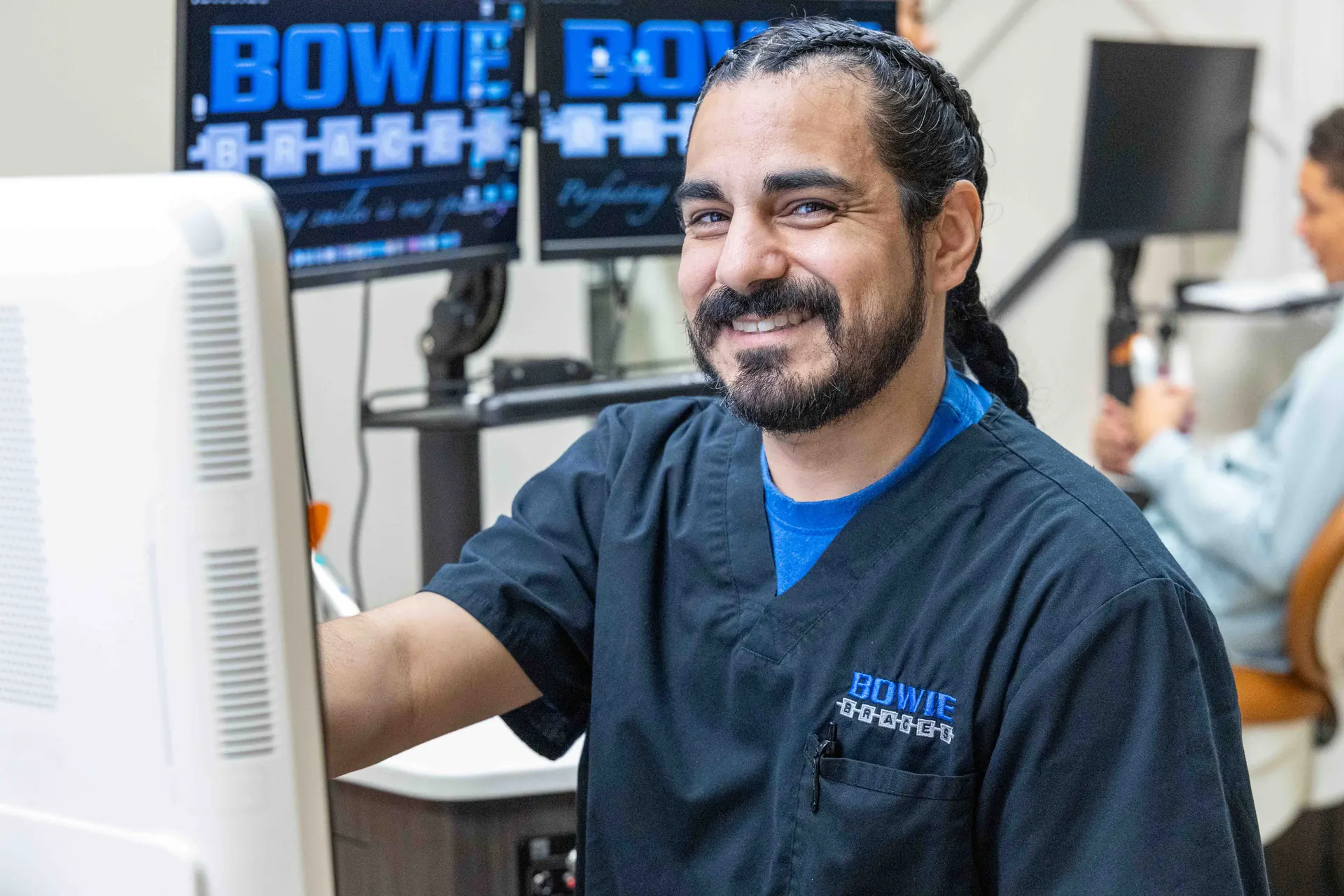 A Bowie Braces team member at a workstation in the Bowie, MD office