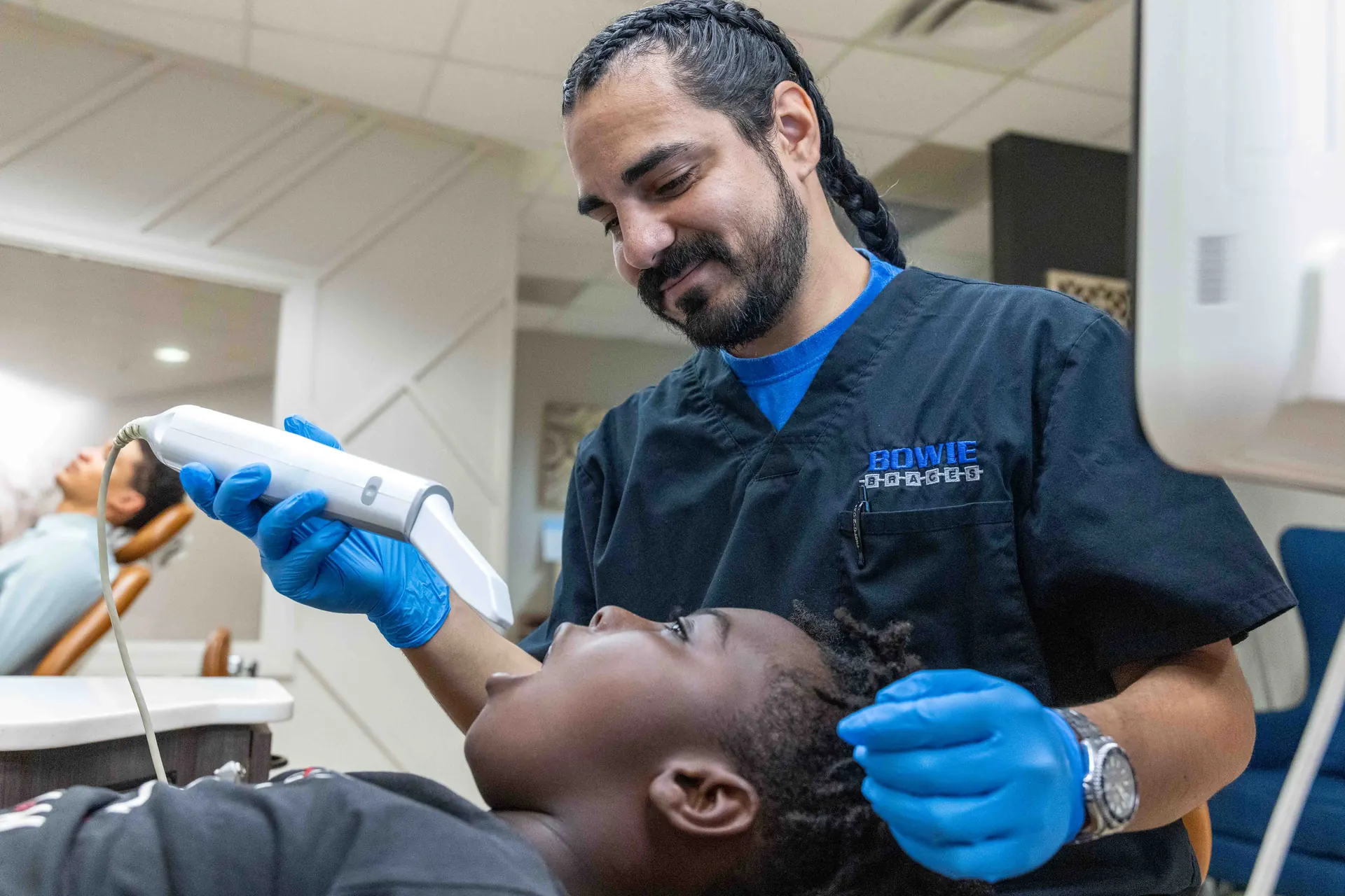An iTero digital scan being taken of a patient's teeth at Bowie Braces