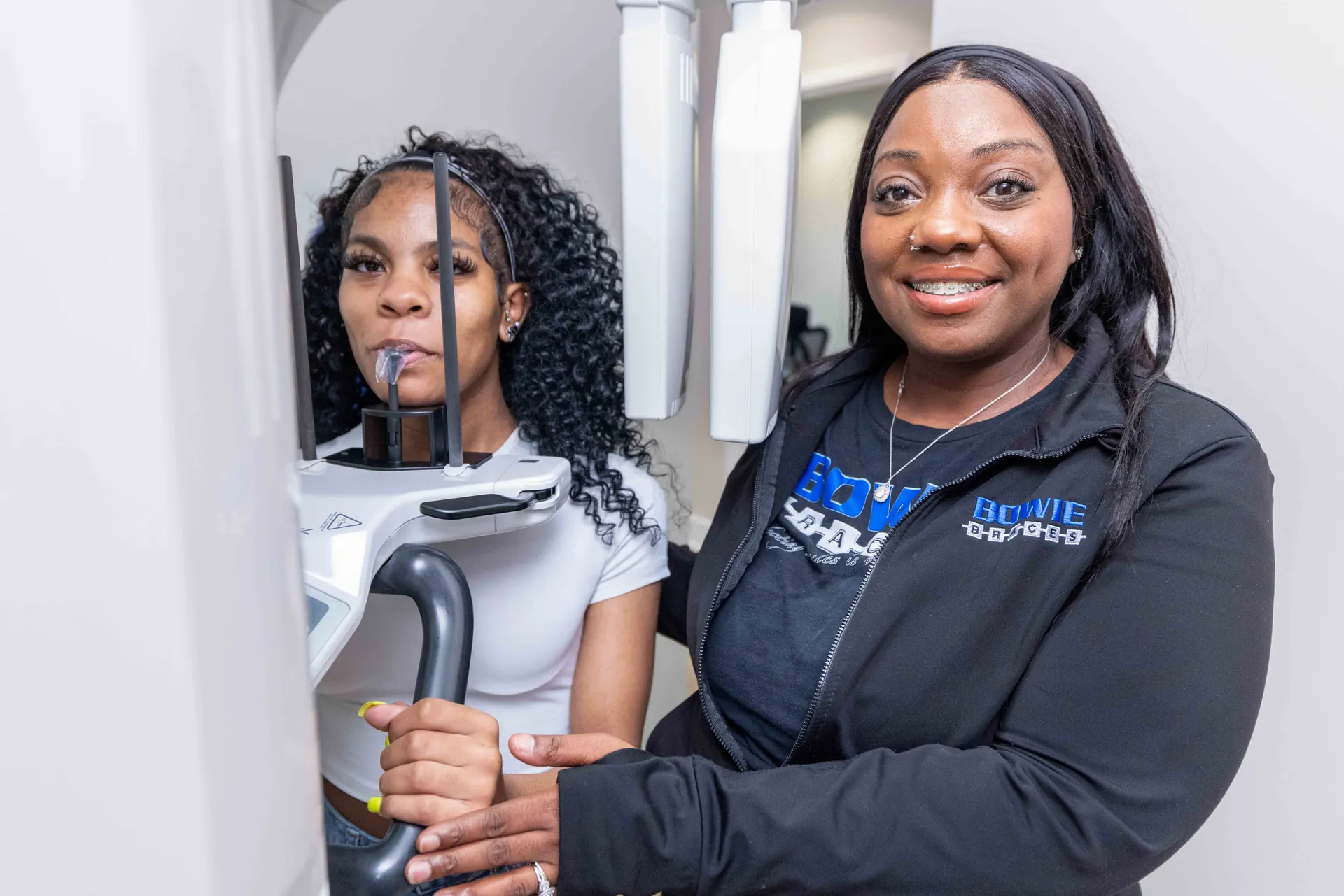 A patient having panoramic orthodontic imaging taken at Bowie Braces