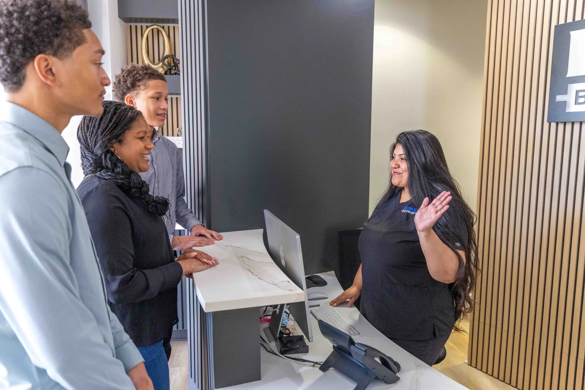 Patients being greeted at the Bowie Braces front desk