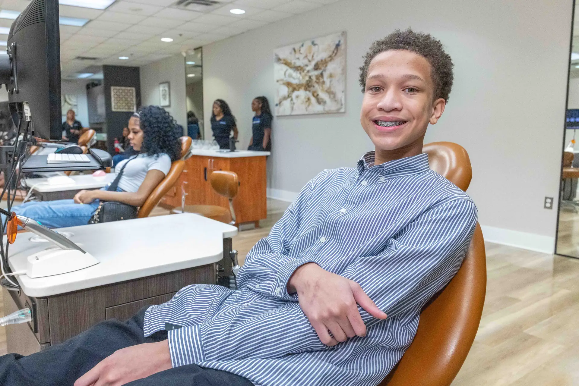 Teen patient smiling with braces at Bowie Braces