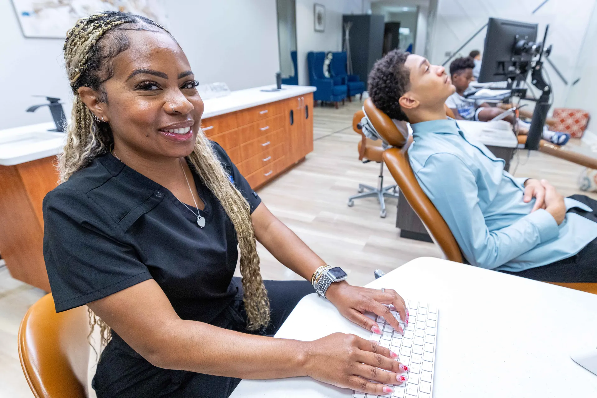 A Bowie Braces clinician at a treatment bay workstation