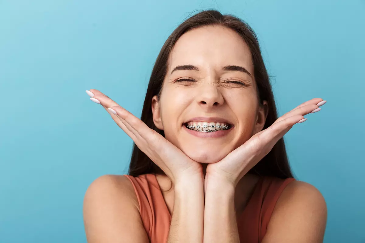 Close-up of clear ceramic braces on teeth